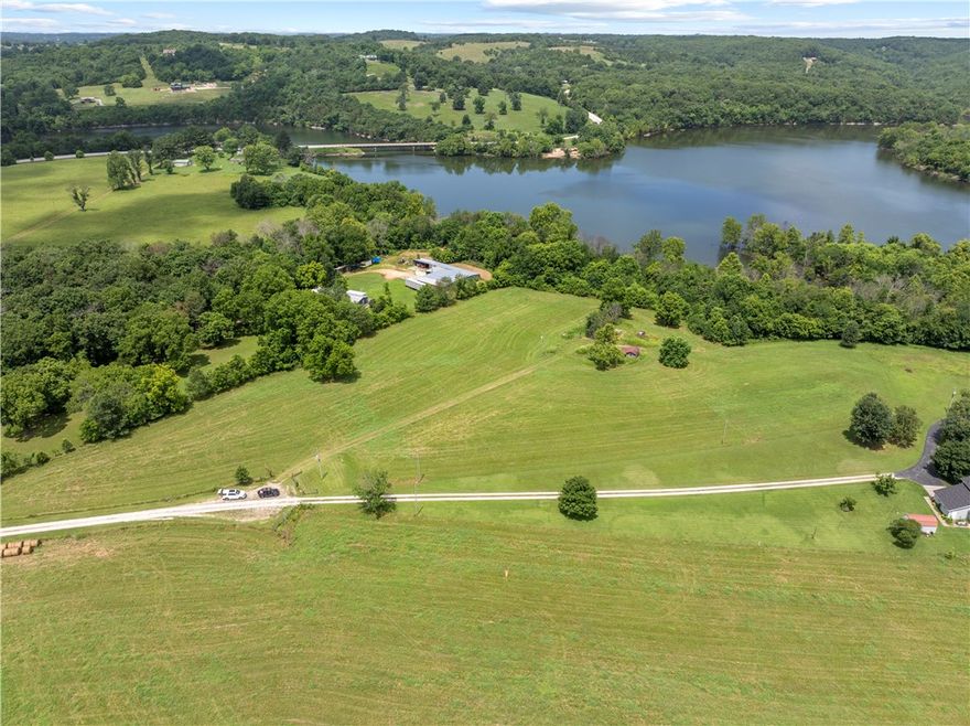 A rare find on Table Rock Lake!
This beautiful property includes two level, clean and peaceful lots totaling 6 acres. The perfect canvas for your dream home, lake retreat or weekend escape. Conveniently located near Enon Bridge, where Long Creek and Yocum Creek meet the main channel of Table Rock Lake, this property provides natural beauty with practical amenities already in place. Improvements include: Two septic systems, buried propane tank, electric, rural water & a private well, RV hook-up, existing storm shelter and storage building. Opportunities like this don't wait - bring your plans, your vision and make this rare Table Rock Lake property your own. 
Combined tax for both lots $437.00.