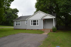 Fabulous 4 bedroom home for an affordable price! With lovely wood floors, a large open kitchen, jacuzzi tub, a soft neutral color scheme, and large lovely windows, this spacious 4 bedroom, 2 bath with a utility room, and large storage building in a convenient Russellville location is a great choice!