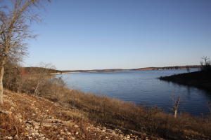 You will enjoy the beautiful sunrise from the main channel view of Bull Shoals Lake. This 16.96 acres is perfect to build your vacation getaway cabin or family home with just a little clearing. Enjoy all the natural beauty, peacefulness and private setting with over 1,250 foot of Corp Frontage with the road already built. A 10' x 28' boat slip may be purchased in addition.