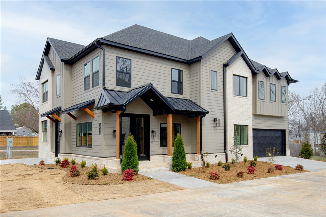 Welcome to this luxury pocket neighborhood, situated within walking or biking distance to the vibrant heart of downtown Bentonville. Enjoy the convenience of nearby biking trails and the charming atmosphere of this sought-after location. Walk to schools, parks, shopping and dining.
This exquisite custom-built home boasts 4 spacious bedrooms and 3.5 bathrooms, thoughtfully designed for both comfort and style. The chef's kitchen is a culinary dream, featuring top-of-the-line appliances, abundant counter space, and elegant cabinetry, making it perfect for entertaining or preparing everyday meals.
The inviting open floor plan seamlessly connects the sophisticated living spaces, filled with natural light, and highlights impeccable craftsmanship and attention to detail throughout.
The home has unfinished walk out attic that can add 250 sq ft built in equity.