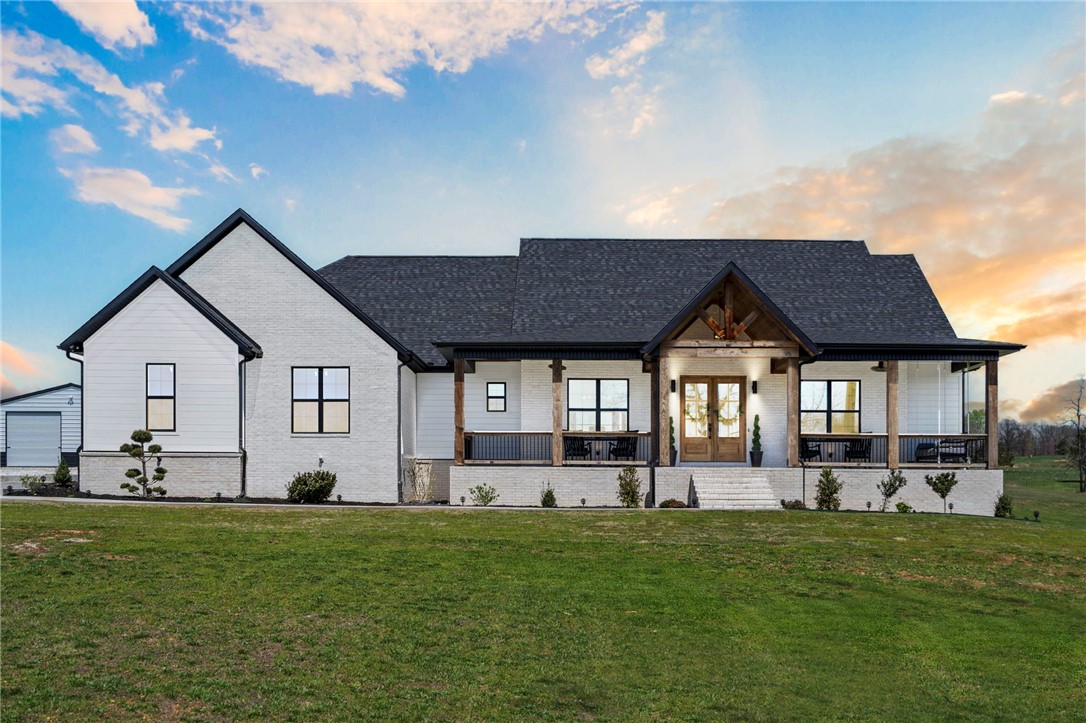 This brand new construction custom home can now be yours! Offering 3 spacious bedrooms all with an en-suite, a private office, and a half bath for your guests. The front porch is a dream looking out over your own fishing pond on your 4.68 acres of land. 3 car side load garages and a 30 X 30 Shop. What more could you want?! Priced perfectly to sell fast! Located just 24 minutes to the Bentonville and 8 minutes to Downtown Rogers, it’s a gem!