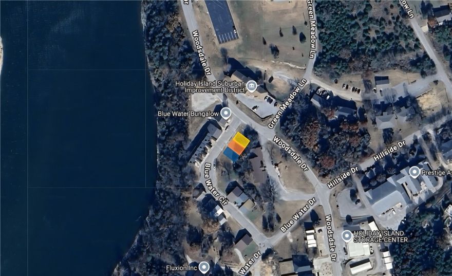 Build your business on this .10 (+/-) acre lot in Holiday Island that is by the water and Holiday Island Marina!! It is close to local amenities and Eureka Springs as well. Property conveys a Limited Warranty Deed. Owner financing available. Call or text for more information.