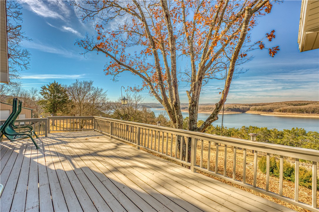 Recently updated home with million-dollar views on the edge of Bull shoals lake! This 4 bed 3 full bath brick and wood siding home has all new hardwood flooring, paint, and light fixtures. This home sits on 2.3 acres, has a 30x50 metal building, and a workshop! Large level backyard with amazing westerly facing views to take in those evening sunsets! The kitchen features newer stainless appliances, hardwood floors, and granite countertops. Cozy up by the gas log fireplace in the living room or enjoy coffee in the sunroom while taking in the gorgeous lake views. Less than 100 yards from the front door there’s a gravel bar used for launching smaller boats and jet skis. Located just 45 minutes to Branson, 40 minutes to Harrison, just under 2 hours to Fayetteville, and just under an hour to the Buffalo National River. 2 Local marinas/ public boat accesses are located just a short drive away at Tucker Hollow and Sugarloaf Harbor Marina.