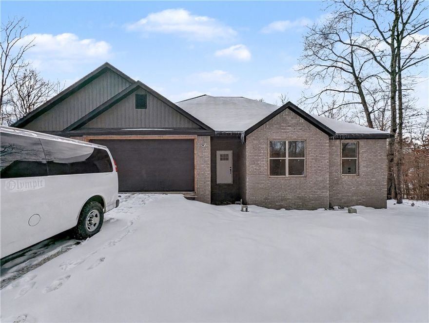 Welcome To Your Next Home! This One’s Got The Space, Style, And Bonus Garage You’ve Been Searching For! Currently, The Only New Build 3-Car Under $400K In Bella Vista! Smart Split Floor Plan With A Vaulted Living Room, Warm Beam Accents, And A Corner Gas Log Fireplace That Sets The Tone. The Kitchen Delivers With Custom Cabinets, Tile Backsplash, Pantry, Under-Cab Lighting, And An Island With Bar Seating Plus Eat-in Dining. The Primary Suite Includes A Full Custom Tile Shower, Dual Vanity, Potty Closet, And A Pass-Through Closet That Connects Straight To The Laundry...Convenience At Its Best. Two Secondary Bedrooms Share A Full Hall Bath. Covered Back Deck With Steps Down To The Backyard, Because That Just Makes Sense! Sodded Yard, Quiet Street, And A Prime Location With Quick Access To I-49, Highlands Golf & Pub, And Branchwood Trails. Just Underway, So You Can Still Make Selections And Truly Make It Yours!