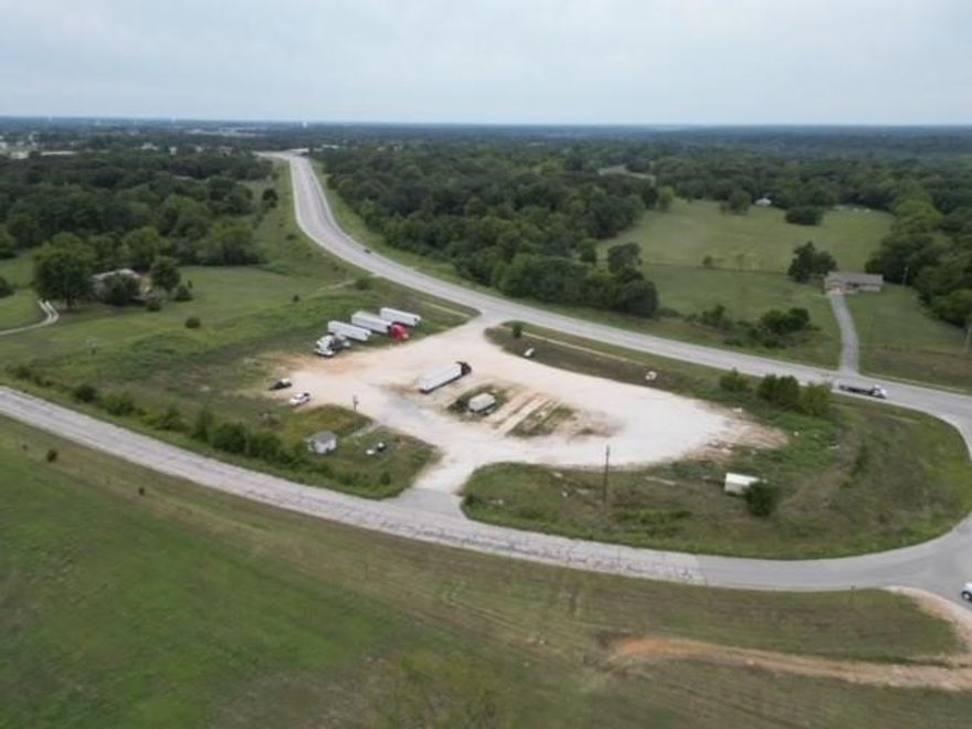 Unlock the potential of this prime 4.33-acre commercial property located on high-traffic Highway 59! With paved road frontage on three sides, this highly visible and accessible parcel offers endless possibilities for development. Currently used for equipment parking, the property is already equipped with rural water and electricity, making it ready for your next business venture. Whether you're envisioning a truck stop, convenience store, car wash, or service-based business, this location is perfectly positioned to serve both local residents and heavy thru-traffic. Opportunities like this don’t come around often—capitalize on this strategic location and bring your commercial vision to life. Schedule your showing today and explore the potential this incredible property has to offer!