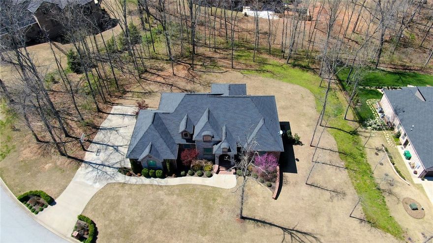 Stunning Custom Built Home by Parade of Homes Builder (Homes of Distinction). Home is located in Popular Versailles Subdivision. Sitting on over an acre Lot w/mature trees & ready for your Pool.  Open Floor Plan w/Formal Dining, Spacious Living Room w/Fireplace, Master on Main & Smart Home Features.  Bright Kitchen is Chef's dream w/Large Island, Double Oven, Granite Counter Tops & Large Pantry.  Gorgeous Master Suite overlooking the backyard w/Hardwood Floors & Double Trey Ceiling. Fabulous Master Bathroom w/Marble Counter Tops, Separate Vanities & Makeup Station, Oversized Walk-in Shower w/Designer Tiles. Guest Suite (In-Law Suite) on main level w/Full Bath.  Amazing Man's Cave in Lower Level w/Media Room & Golf Simulator & Mini-Kitchen / Wet Bar Area.  Super Walk-Out Basement w/10' Ceiling, Concrete Flooring, Living Area, Game Rm, Office, 2 Half-Baths & 2 On-Suite Bedrooms w/Full Baths.   Don’t miss out your chance to own a Beautiful Custom Built Home w/Lots of Great Features.