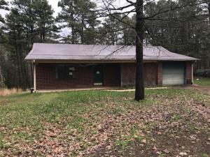 **PROPERTY IN MULTIPLE OFFER ROUND, PLEASE SUBMIT HIGHEST AND BEST BY 5:00 PM SATURDAY MAY 16TH. MULTIPLE OFFER FORM FOUND IN DOCUMENTS. MUST ACCOMPANY OFFER. If you are wanting just outside of town, but still be close enough for conveniences, this is the perfect place. Large 1 acre lot, brick ranch with attached garage, 2 bedroom, 1.5 bath. Property sold as is where is.Property sold as is where is. Seller to convey title via a quit claim/non warranty deed only.Due to condition, the property may have health/safety risk(s). Prior to entry / access, all parties must sign a Hold Harmless Agreement and the property may only be shown by appointment''