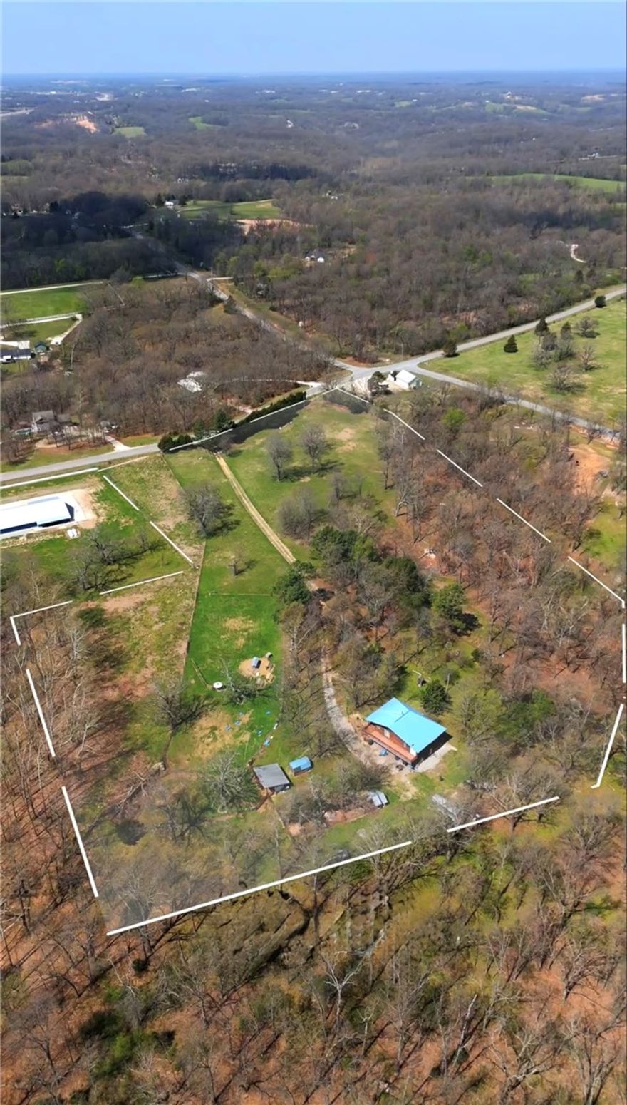 10 Acres in a Prime NWA Location, Endless Potential. Rare opportunity to own 10 mostly flat acres just 15 minutes from Downtown Bentonville and the new Walmart Home Office, and less than 10 minutes to the interstate. The property is already divided into three tracts of approximately 3.3 acres each, offering flexibility for a variety of uses. Ideal for builders and developers for luxury custom homes, with nearby comparable sales exceeding $1M. The location sits in a high-growth corridor between major infrastructure and employment hubs, making it a strong candidate for future residential subdivision. Investors will appreciate the rapid growth of Northwest Arkansas and the increasing demand for housing in this area. For those seeking privacy, this property also presents the perfect setting for a private estate or family compound. Whether you're planning a luxury build, development project, or private retreat, this versatile 10-acre property delivers location, opportunity, and long-term value. Also Listed MLS 1333451
