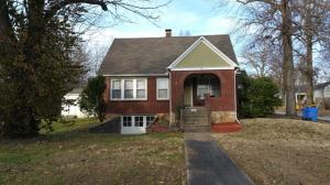 Nice brick 3 BD 1.5 BA home on 1 acre m/l; tree shaded lot; 24x32 detached garage; newer kitchen; hardwood floors, concrete room in basement that could be used for storm shelter in basement