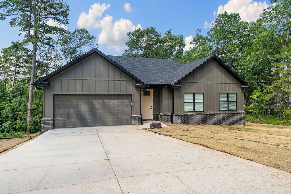Come see this fantastic new construction home with a one year builder's warranty! There is so much to love about this home: The inviting, contemporary exterior with dark roof, windows and gutter lead into the crisp, clean, contemporary aesthetic of the interior. With fabulous storage and intentional use of space, the home has a great pantry, utility room and lots of storage in closets and attic space. This is a true 3 bedroom home on city sewer and not septic, and, unlike most new builds, this home comes with a propane tank installed. Located on the East side of Hwy 71 there is easy access to downtown Bentonville (which is 10 miles away) and all the biking trails. Be a part of the thriving biking community in Northwest Arkansas and enjoy all the amenities that Bella Vista has to offer with it's golf courses, hiking, bike trails, clubhouse, swimming pools and lakes.