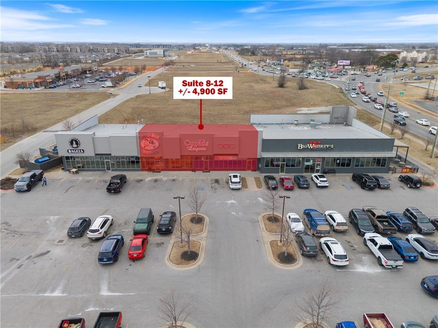 This prime +/- 4,900 SF retail space in Bentonville offers an exceptional opportunity for businesses seeking high visibility and foot traffic. Located off Walton Blvd, which sees approx. 36,000 VPD, also near Rainbow Curve, a major intersection with an average of 27,000 VPD. Nestled within a bustling multi-tenant center, this suite shares a building with popular local businesses like Ozark Mountain Bagel Company and Big Whisky's restaurant, ensuring a steady stream of potential customers. Currently occupied by a retail storefronts, the suites feature a spacious retail floor, abundant natural light, and ample window space to showcase your business. Signage opportunities on front and back of the building, as well as the entrance door. Offered on a NNN lease, tenant is responsible for all utilities, prorata share of trash, gen liability, prorated portion of taxes, property insurance, and CAM. A minimum 4-year term is required. Don't miss this prime retail opportunity in one of Bentonville's busiest areas!