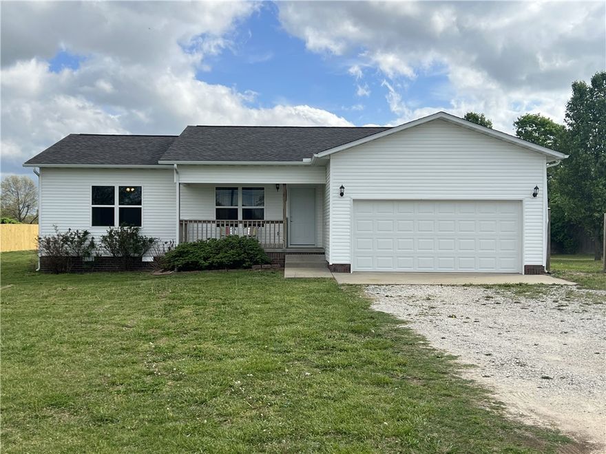 Move-in ready 3BR-2BA home with 0.91 acre!! This cozy 1,400 SQFT home was built in 2014 and features many updates including new paint, tiled in shower and bathtub, some new appliances, and so much more.  The kitchen includes a walk-in pantry, butcher block countertops, and all the appliances convey.  The back deck is recently rebuilt and overlooks the mostly fenced, level yard with a distant mountain view. This country home has a covered front porch, 2 car attached garage, and is accessed by a paved road. Only 5 minutes from Harrison!!