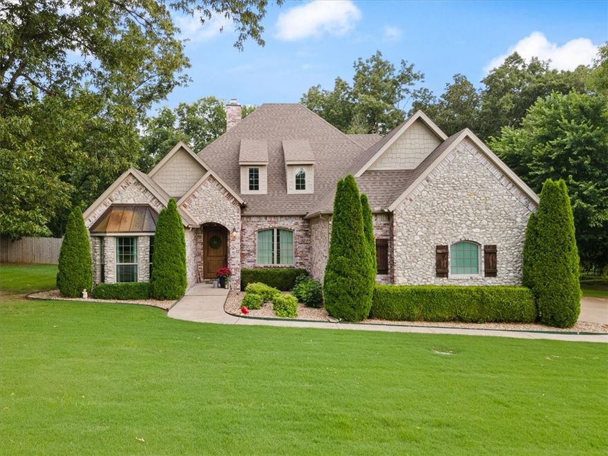 Stunning home in West Haven on a level 1.13 acre wooded lot! Convenient access to I-49! Features include 4BD's (3 on main level) / 4BA's, office, formal dining, game room, and media room! You will be greeted by a large entry leading to a living room adorned with exposed brick, stone fireplace, and elegant wood beams. The living area features the added comfort of heated floors, while the kitchen offers an abundance of cabinet space. The primary bedroom features a charming bay window with outdoor access. Additional highlights include a spacious laundry room with extra storage and a utility sink. Step outside to discover a heated saltwater pool with an automatic cover and an outdoor kitchen ideal for hosting gatherings. Roof was replaced in 2018.