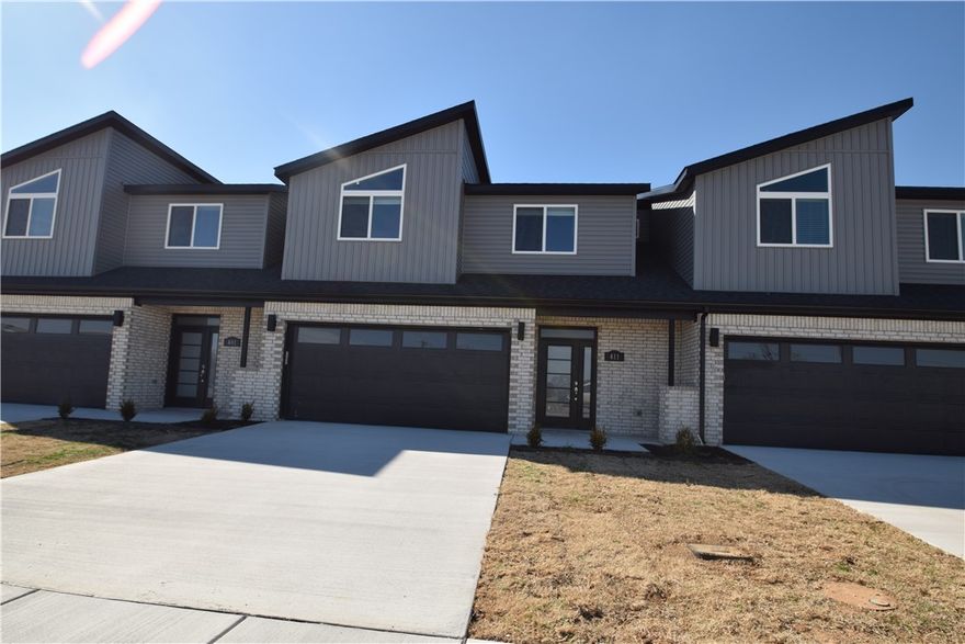 New modern design duplex! Also included brand new side by side stainless refrigerator, washer and dryer. This 3 bed 2 1/2 bath plan has an open living concept with tall ceilings and tons of natural light. Kitchen has granite countertops, stainless appliances, a large pantry, and a gas range. Primary suite is on the main floor and has a beautiful walk-in shower and a large walk-in closet. Two bedrooms upstairs with a full bath and landing. Wood look tile in the main living areas, 2" faux wood blinds, extra storage in the upstairs attic. Property has a private back patio and wood privacy fence. Owner must approve pets and no smoking.