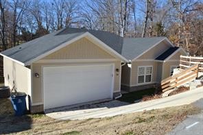 Needs paint, flooring and light deferred maintenance. Short sale in the process of being approved. One of Bella Vista's most desired areas. Walking distance to Metfield Park (pool/playground/pickleball), Dogwood Golf Course and many of the Bella Vista walking/bike trails. Private setting with back yard with large deck for entertaining and enjoying the beautifully wooded views. 3 bed, 2 bath with many custom touches including thick granite counters throughout, shiplap walls, floating electric fireplace, beautiful LVP in main areas. Open kitchen, dining and great room to host large gatherings! Large Owners retreat with ensuite including tile shower, soaker tub and giant closet designed to pamper the owner! Unexpectedly large laundry/mud room and pantry to provide ample storage and functionality! Front courtyard with lots of shade and privacy to enjoy NWA outdoors! All set in Bella Vista with ample golf, tennis, lakes, trails, parks, community gathering/exercise facilities and several restaurants.