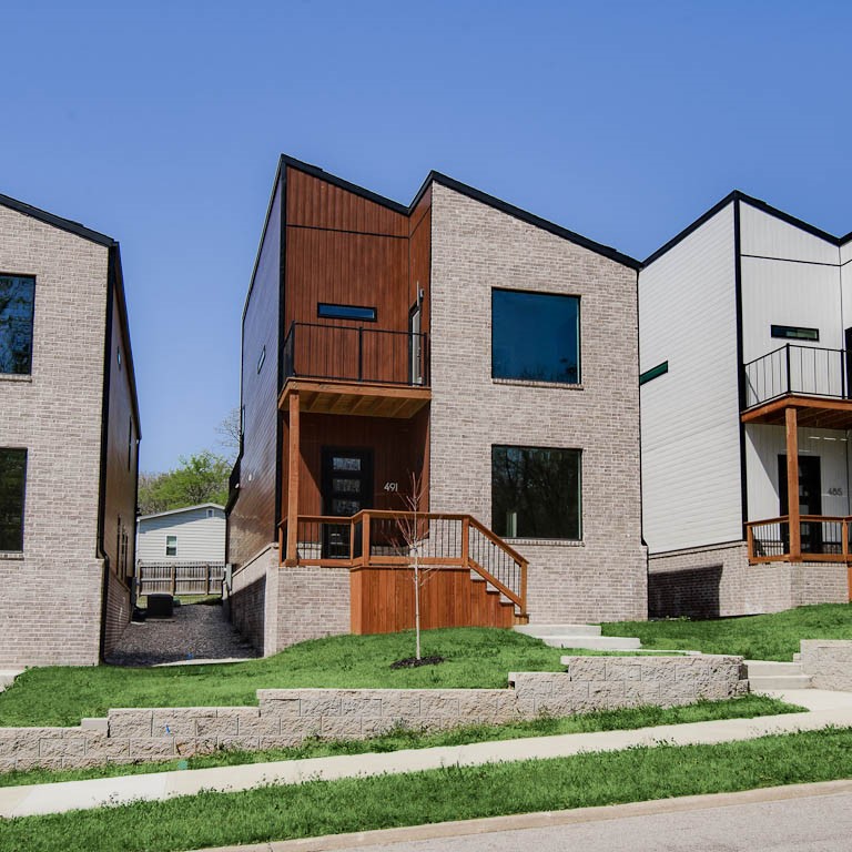 Experience the height of modern luxury in this beautifully designed urban retreat. Blending contemporary style with thoughtful functionality, this home features an open-concept filled with natural light from expansive windows, creating a bright and welcoming ambiance. The kitchen is a true centerpiece, complete with quartz countertops, custom cabinetry, and stainless steel appliances—perfect for both entertaining and everyday living. Flowing effortlessly into the spacious living areas, it sets the stage for cozy family dinners. Upstairs, the primary suite offers a peaceful escape with vaulted ceilings, a private balcony, and a sleek en-suite bathroom with a stunning tiled shower. Additional bedrooms also feature vaulted ceilings and share a second bathroom finished with modern touches. Step outside to a large rear balcony, ideal for outdoor entertaining or unwinding under the stars. Situated just 2 miles from the lively Dickson Street and Fayetteville Square, you’ll enjoy quick access to top dining and shopping.