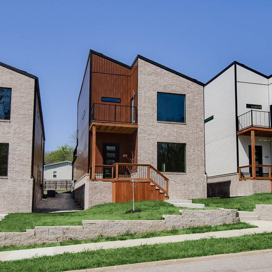 Experience the height of modern luxury in this beautifully designed urban retreat. Blending contemporary style with thoughtful functionality, this home features an open-concept filled with natural light from expansive windows, creating a bright and welcoming ambiance. The kitchen is a true centerpiece, complete with quartz countertops, custom cabinetry, and stainless steel appliances—perfect for both entertaining and everyday living. Flowing effortlessly into the spacious living areas, it sets the stage for cozy family dinners. Upstairs, the primary suite offers a peaceful escape with vaulted ceilings, a private balcony, and a sleek en-suite bathroom with a stunning tiled shower. Additional bedrooms also feature vaulted ceilings and share a second bathroom finished with modern touches. Step outside to a large rear balcony, ideal for outdoor entertaining or unwinding under the stars. Situated just 2 miles from the lively Dickson Street and Fayetteville Square, you’ll enjoy quick access to top dining and shopping.