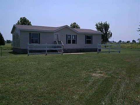 Welcome to peaceful country living at 10290 John Zodrow Rd in Gentry! This well-maintained 3 bedroom, 2 bath manufactured home offers 1,404 sq ft of comfortable living space on a spacious lot. Enjoy an open floor plan with a bright living area, functional kitchen, and split bedroom layout. Perfect for anyone seeking quiet surroundings with room to grow, don’t miss out on this affordable gem in a serene setting!