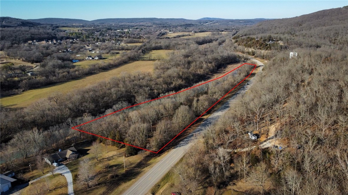 Discover the perfect blend of tranquility and convenience on this 6 acre river front property. Ideal for your dream home or an Airbnb retreat, it offers stunning riverside property setting conveniently located on Hwy 71 just south of West Fork.