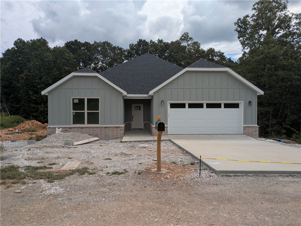 New construction on a large .36 acre wooded lot located near the Back 40 Trails, Lake Brittany, and Metfield Golf Course! Bentonville schools! Step inside to discover an inviting open concept design featuring 10ā ceilings and beautiful floors that enhance the spacious feel of the home. The stylish kitchen is equipped with a gas range, 3 cm quartz countertops, custom cabinets, and a walk-in pantry. Entertain or unwind in the living area, complete with a stunning fireplace, or step out onto the covered patio to enjoy the peaceful surroundings. The primary suite features a massive walk-in tile shower and closet. 2 bedrooms + office. High-end finishes throughout. Buyer can receive $3,500 in closing costs when using the builder's preferred lender!