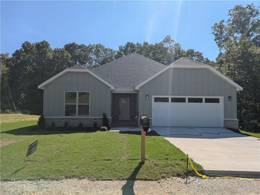 New construction on a large .36 acre wooded lot located near the Back 40 Trails, Lake Brittany, and Metfield Golf Course! Bentonville schools! 2BD's + office. Step inside to discover an inviting open concept design featuring 10’ ceilings and beautiful floors that enhance the spacious feel of the home. The stylish kitchen is equipped with a gas range, 3 cm quartz countertops, custom cabinets, and a walk-in pantry. Entertain or unwind in the living area, complete with a stunning fireplace, or step out onto the covered patio to enjoy the peaceful surroundings. The primary suite features a massive walk-in tile shower and closet. 2 bedrooms + office. High-end finishes throughout. Buyer can receive $3,500 in closing costs when using the builder's preferred lender!