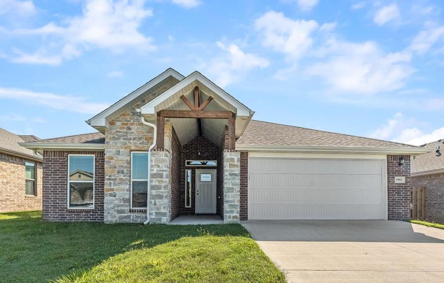Like-new, all-brick Schuber Mitchell home in desirable Woodward Hills! This well-built 4-bedroom, 2-bath home offers over 2,000 sq ft of spacious living. The front bedroom is ideal for a home office. The primary suite features a trayed ceiling, a tiled walk-in shower, and a relaxing garden tub. Enjoy your backyard with a covered concrete patio. Located just minutes from NWA Regional Airport, Benton County Fairgrounds, and only 20 minutes to the Walmart Home Office. Whether you're looking for a new home or a great investment, this property is a must-see! Easy to show—schedule your tour today!