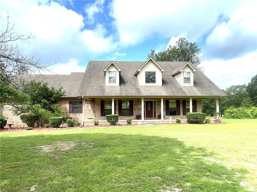 Discover the perfect blend of elegance & comfort in this stunning home nestled on a serene 2.5 acre lot near the prestigious Russellville Country Club. This exceptional home boasting a spacious layout, features 4 bedrooms and 4 baths, ensuring ample space for family & guests alike. The interior is highlighted by an inviting living area with a fireplace, office, and versatile bonus room that can serve as a media room or recreational area. A formal dining room and a cozy eat-in area offer flexible dining options to suit any occasion. Step outside onto the expansive back deck, where peaceful views of the grounds provide an ideal setting for relaxation & outdoor entertaining. A 3-car garage provides generous storage, & parking space, ensuring convenience & functionality.