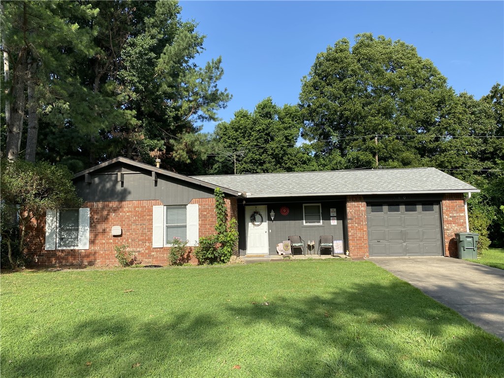 PENDING UPON PRINT. Fantastic opportunity for first-time buyers or investors alike! This charming all-brick home boasts 3 bedrooms and 2 bathrooms. Step inside to discover a spacious living room with beautiful wood laminate flooring and a cozy fireplace. The open eat-in kitchen offers ample cabinet and counter space, perfect for culinary enthusiasts. The generously sized bedrooms provide comfort and relaxation. Additionally, the property includes a convenient 1-car garage and a chain-link fenced backyard, ensuring both security and privacy. Don't let this chance slip away to make this your new home or a smart investment choice!