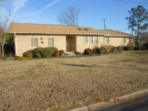 Wonderful Well Built Home with lots of Space!Currently set up with 2 master bedrooms but could be living room and den or man cave! Recently remodeled with granite counters in kitchen and all baths, Nice wood floors, 4 bedrooms, 2 1/2 baths, and huge walk in pantry area! Huge covered patio in privacy fenced backyard is great for entertaining or afternoon grilling and the big workshop is a dream area for dad! TV in Living area stays along with fridge in kitchen! All other bedroom tvs do not convey but mounts will convey! Super Clean home close to Hospital and shopping great for retired! Owner currently renting home as investment home through VRBO, so appointment is needed and all furnishings could be included for additional cost.