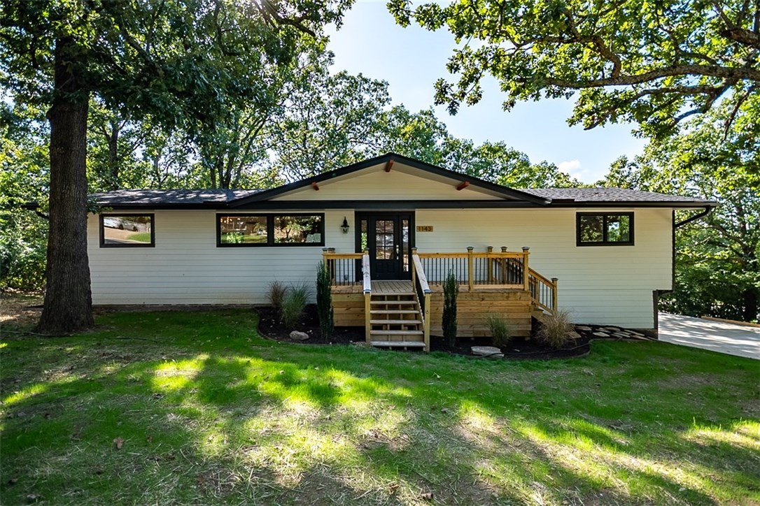 Only a mile from UofA and Razorback sports! Close to Whole Foods and Wilson Park! Completely remodeled over 3,400 sqft! New roof, siding, Pella windows, HVAC, interior, etc.. You name it, it's new! 4 Bedroom including a master suite and 3.5 bathrooms and walk-in closets! Granite Counters throughout! Beautiful open concept living area with cathedral ceilings! Great Island in kitchen with bar seating and wine fridge included in Island! Deck along the entire backside of the house and a front Patio! Tons of storage!