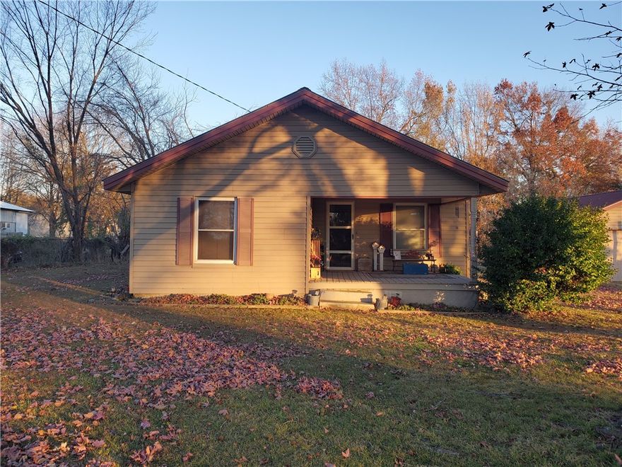 3 Bedroom 1 bath home. Original hardwood floors in living room.  Large backyard with a detached 2 car garage.  Hwy 112 will be widened to 4 lanes with a bike trail on the east side going along the front of this property.  ARDOT has acquired frontage from the property. New lot line is marked with a flag. See the attached documents for more information.  Construction is not scheduled yet but will be 2027 at the earliest according to ARDOT.  Property is currently zoned commercial. Property also listed as Commercial MLS#1309946