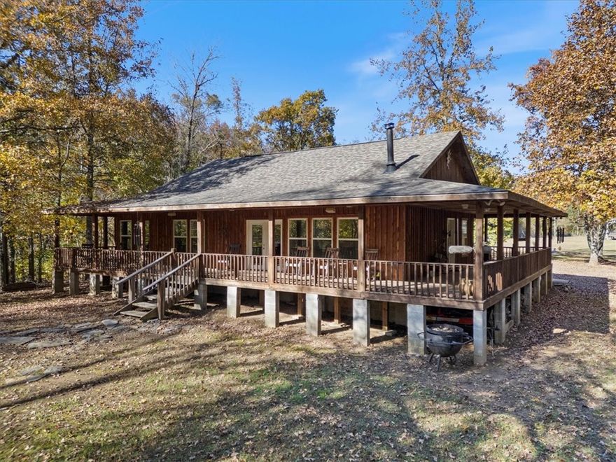 Exceptional Ozark retreat in the heart of the Little Mulberry Creek Valley, just 5 miles north of Hwy 215. This rare opportunity offers 670 ft of Little Mulberry Creek frontage and 650 ft of Friley Creek frontage and just over 100 yards from their confluence sits a beautiful cabin with over 1700 sq ft of covered porch space, partially enclosed to ensure you can take in the beauty of the landscape year round.  Open kitchen and living area with lots of windows for awesome lighting and gorgeous views. It's hard to describe this peaceful setting until you experience it for yourself. Gated entrance for complete seclusion and privacy. Well, electric and fiber on site. Roughly 5.5 acres with additional acreage available. One of the most scenic and secluded valleys in the Ozarks.
