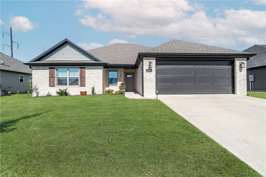 Here's your chance! Check out this 2022 absolute beauty on a over-sized (huge!) lot in the new Endura Park subdivision in Siloam Springs. This exceptionally efficient and open layout (1607sqft, 3ba/2ba) has all the right touches and upgrades! Enjoy your massive kitchen w/ high-end light fixtures, granite countertops, and stainless steel appliances. Relax in the massive master's suite or out on the 180sqft large patio addition. Enjoy outside in your expansive backyard w/ privacy fence. Or cozy up to a fire in front of your gorgeous floor-to-ceiling brick hearth. This house is better than new! Schedule your appointment now!
