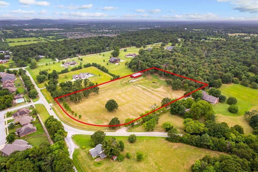 Your Dream Opportunity awaits on Highway 112, Fayetteville, AR. This stunning property surrounded by estate homes has 6.34 acres with a prime location as it is just a quick 10-minute drive to I-49, University of Arkansas, Uptown Fayetteville, and Dickson Street. 

The property is full of natural beauty as it is adorned with large oak trees, lush green grass, and stunning big sky views. The property also has a spacious 40 x 80 barn, recently constructed (2023), perfect for storage, hobbies, or future projects.

This rolling 6.34-acre property is ready to be the site of your new dream home. With its convenient location and picturesque setting, it offers the perfect blend of tranquility and accessibility. Don't miss this incredible opportunity to create your own personal paradise in Fayetteville!