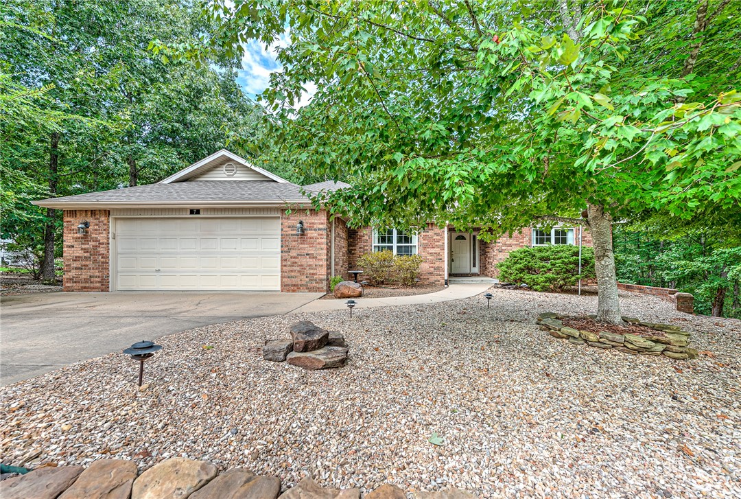 Located in a desirable neighborhood in the Highlands of Bella Vista, this well-maintained 3 bedroom, 2 bath home nestled on a quiet street features real wood floors, quartz countertops throughout, an updated primary bathroom, dining room, plus a breakfast nook. Enjoy the backyard views from the comfort of the sunroom with a HVAC window unit or from the outdoor deck. Just downstairs from the deck is a large temperature controlled workroom with lots of space for projects and storage. This is the best of worry-free living with many recent updates, including a new roof (Nov. 2021), HVAC (March 2023) and water heater (Nov. 2022).