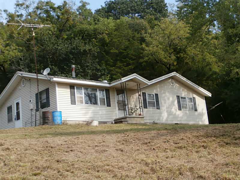 4 bedroom home is perfect for hunting lodge. Mostly wooded with very good 15 acres of pasture with creeks frontage. Great for all kinds of hunting. Raise crops, livestock or use for recreation. Wildlife includes bears, turkey's, deer, squirrel, etc.