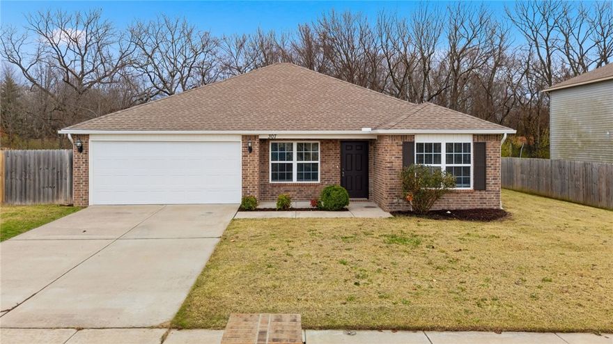 PRIME LOCATION! This adorable 4 bedroom home in the Lakewood Subdivision sits on one of the biggest lots in the neighborhood. The open concept living room looks into your eat-in kitchen, perfect for entertaining and enjoying cooking while still being a part of everything that is going on in the living room. Split level floor plan features the master suite and laundry room just off of the garage and the other bedrooms on the opposite side. Step out on to your patio and enjoy a large spacious backyard  Conveniently located in the heart of Northwest Arkansas where everyone wants to be. Perfect for a first time homebuyer or for an investor. Move in ready and priced to sell quickly.