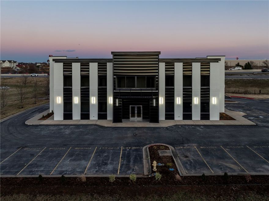 Premier office space in a prime location centrally positioned between Bentonville and Rogers. Notably one of the most visible properties available on I-49 in Benton County. Complete exterior renovation in 2025. This 2 story Class A office was previously used as a real estate office. Currently has open reception with elevator and 2 conference rooms, 35 private offices, large training room with drop down projection, central audio system, large kitchen breakroom area and private restrooms on both floors. 2-5 minutes from Sam's Home Office and Walmart Campus. Easy access to both 71B and I-49. Buyer to choose flooring and paint throughout. Marketed for lease MLS 1339399.