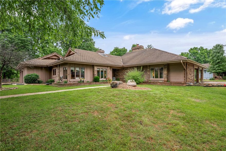 Open House May 31, 1-4pm. This luxury 1-level townhouse became even better with recent upgrades. Amazing property; spacious rooms; main living has tall wood ceiling with large beam & woodburning fireplace; large main bedroom & bathroom; large walk-in closet; beautiful walk-in shower. Heated/cooled sunroom with wall of windows provides natural light in addition to the view of beautiful trees & rolling water of Little Sugar Creek. The peaceful enjoyment of nature is appreciated from inside the home & also from the patio that has brick privacy wall. Evenings have extra ambience from the soft glow illuminated from what resembles a street light exclusive to this patio. This home is surrounded by the Country Club Golf Course. The drive through this subdivision confirms its desirability. In addition to Sugar Creek, the beautiful golf course & lush wooded areas, the homes are well-maintained with designed landscaping. Level streets for nice walks. Home is close to trails, golf, parks, pools, tennis, other BVista amenities.
