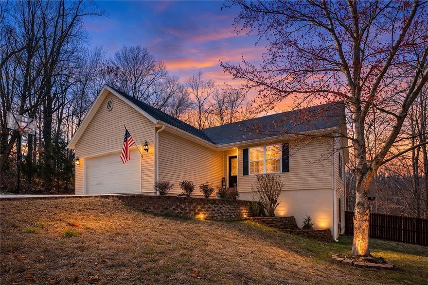 Trail-side living meets meticulous care in this beautifully maintained Bella Vista home. Ideally located within biking and walking distance to Tunnel Vision, Tweety Bird, Down Under, and the new bike lift, this property offers the perfect blend of comfort and adventure. The open concept main level is bright and welcoming, while the fully finished basement adds incredible flexibility with two bedrooms, a full bathroom, and bonus space for a second living area, office, or recreation. Thoughtful updates include a new roof (2020), water heater (2024), deck (2023), and recently replaced kitchen sink. Step outside to a spacious fenced backyard with a separate dog area, creating a setup that is both functional and inviting. With no neighbors currently on either side or across the street, the setting offers a rare sense of privacy that feels like a private cul-de-sac. Move-in ready and designed to enjoy the very best of Bella Vista living. Sellers completed a pre-listing inspection, giving added confidence!