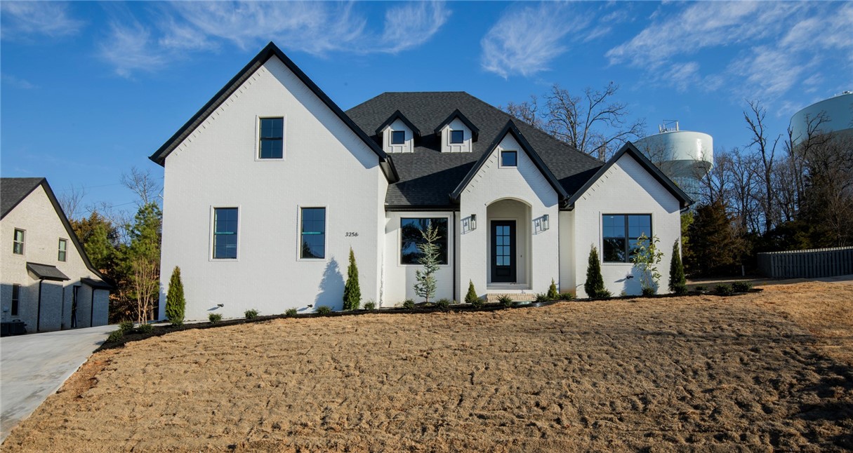 Seize the opportunity to own a stunning, newly-built modern home in the coveted Sloan Estates neighborhood in East Fayetteville. Situated on one of the final available lots, this luxurious home offers an expansive main living area, 4 spacious bedrooms, and 4 elegant bathrooms.
The chef-inspired kitchen is a culinary haven, featuring double ovens, a gas stovetop with pot filler, a large island with waterfall quartz countertops, and a walk-in pantry. The master suite is a true retreat with an oversized closet complete with built-in storage solutions, a double vanity, a vessel tub, and a marble-tiled shower.
This thoughtfully designed home includes a second main-floor bedroom and a versatile second-floor bonus room. Enjoy the warmth and beauty of hardwood floors, complemented by a grand floor-to-ceiling fireplace and a generous office space.
Located just minutes from Vandergriff and McNair schools, as well as local grocery stores and restaurants, this exquisitely appointed home offers both luxury and convenience.