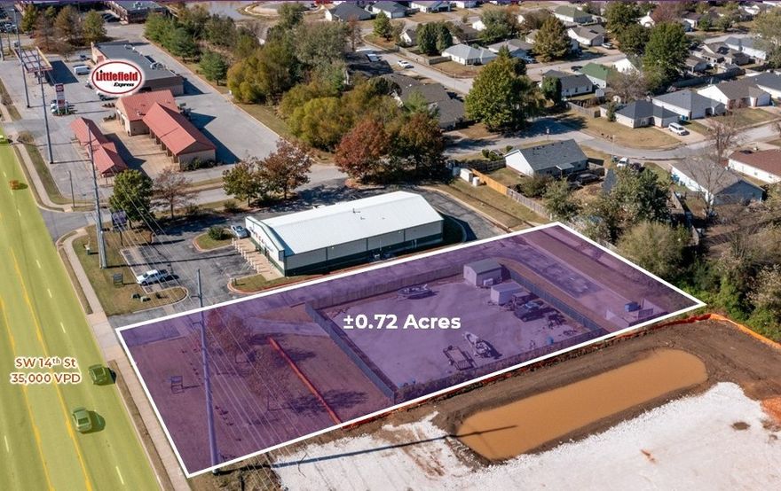 Approximately 127 linear feet of frontage on SW 14th St.  Filled, graded and paved pad.  Detention in place for future building.  Shared access drives and enclosed dumpster.  SW 14th St frontage has been landscaped.  Multiple points of access to the property.