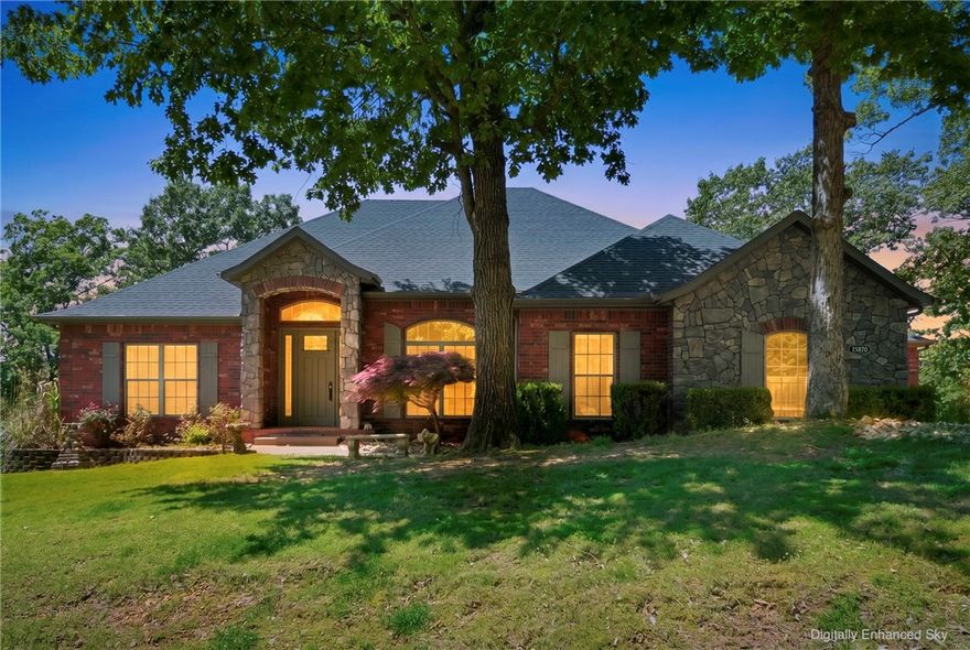 Experience this stunning sanctuary perfectly positioned near the shores of Beaver Lake. This estate in the gated Sunset Bay community offers a blend of luxury and natural beauty. The seasonal lake view along with the numerous mature trees surrounded you with nature. The interior boasts an expansive, light-filled layout with high-end finishes, soaring ceilings, and a flow designed for both entertaining and relaxation. A gourmet kitchen, elegant primary suite, and multiple living areas ensure comfort at every turn. 
The upper level features an office, formal dining room, primary bedroom, living room, laundry, and a half bath. 
The lower level features a second living room, half bath, 2 bedrooms with a jack 'n Jill bath, a bonus room, and a huge storage space that would make an excellent shop or studio. With its upper deck and lower patio, this home offers the privacy you crave while being just a short drive from downtown Rogers. 
View the Virtual Tour now and schedule your in-person viewing today!
