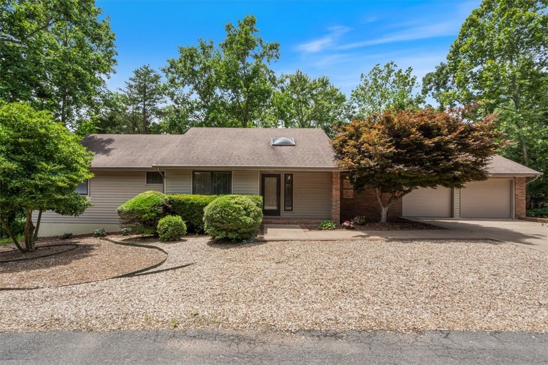 Nestled on a quiet cul de sac with a manicured maintenance free yard, this home is located 3 minutes from Branchwood rec center and 5 minutes from Highlands golf course and Stoneykirk boat ramp.
The home has under gone numerous upgrades during the past couple years. Owners have installed new flooring, lighting, ceiling fans, garage doors, smoke detectors, electrical outlets, stainless steel appliances
and in the past 2 months, quartz counter tops in the kitchen and 2 new hot water tanks.
On the main level is a massive living room with soaring wood ceilings that is complimented by the matching formal dining room.
The spacious primary bedroom gives you opportunity for numerous ways to position furniture. The adjoining primary bath boosts double vanity, shower and tub. There is a second bedroom, additional full bath, office, utility room with half bath, kitchen and screened in sun room. Downstairs is complete with bedroom, full bath, game and family room, workshop and storage.
Home is on 2 bedroom septic