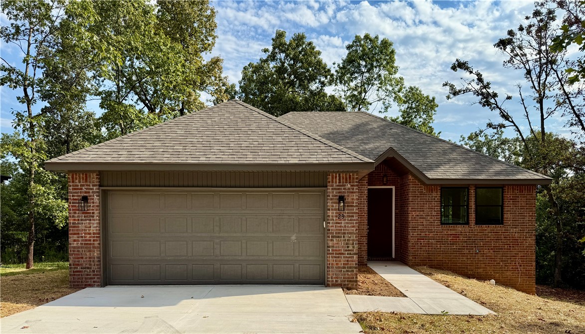 This beautiful brand-new 2 bedroom, 2 bath home offers 1,300 sq. ft. of thoughtfully designed living space in a prime location just 1 mile from Tyree Park on Loch Lomond Lake and minutes from I-49. Inside, youāll find luxury vinyl plank flooring throughout the main areas, tile in the bathrooms, and a cozy gas log fireplace in the living room. The modern kitchen is complete with a glass cooktop and vented microwave.
Abundant windows fill the home with natural light, with 32-inch doors tomost rooms. Step outside to a large, fairly flat yard for Bella Vistaāand enjoy the convenience of the 10 X 19 concrete part covered patio and a 2-car garage.