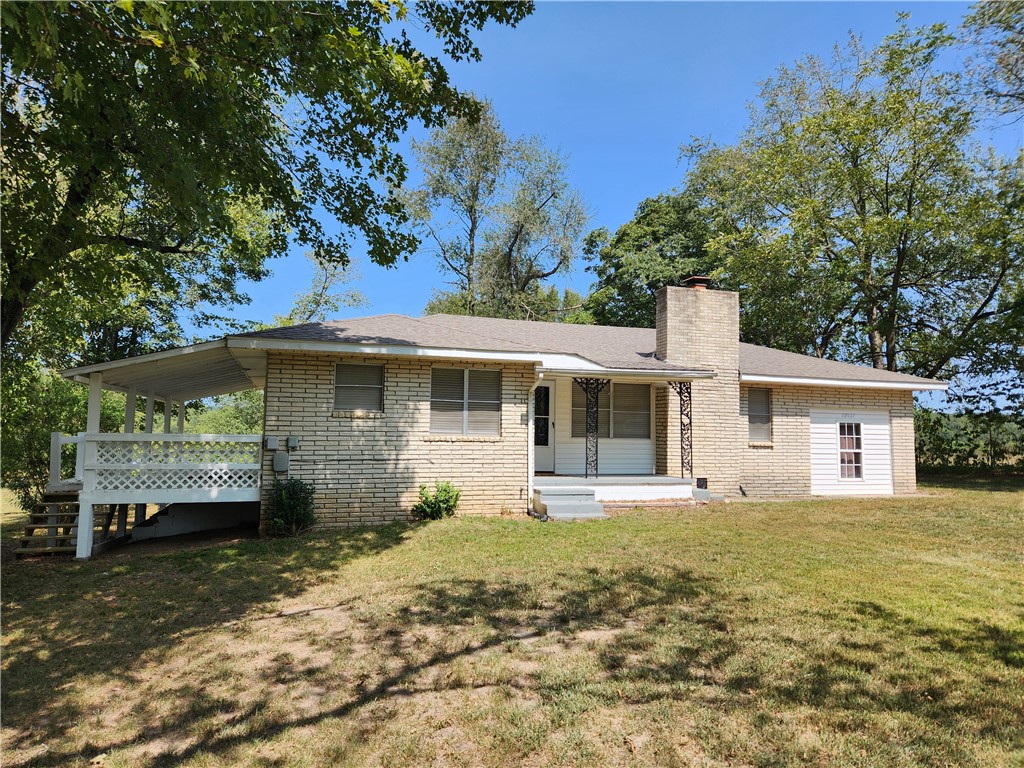 Welcome to your new home in the heart of the Ozarks. Nestled at 22562 Hwy 412, this property offers a good blend of rustic charm and contemporary convenience. The home greets you with a well-maintained exterior featuring a classic farmhouse design and a welcoming front porch that frames the property beautifully. The property features a spacious backyard with room for outdoor activities, gardening, or simply relaxing and enjoying the fresh air. A patio area provides the perfect setting for barbecues and gatherings. Located in the picturesque Ozarks and half a mile from the beautiful Kings River, this home offers country pasture views and a peaceful rural setting, yet is conveniently close to local amenities and services. This property represents a unique opportunity to experience the best of country living while enjoying modern comforts. Whether you're looking for a retreat or a place to raise a family, 22562 Hwy 412 has it all. Easy access to Hwy 412, for a straightforward commute to nearby towns and cities.