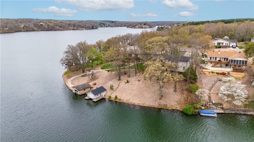 Welcome To Your Next Home! This One Is Where All Your Dreams Come True! Fully Remodeled LAKEFRONT On Lake Loch Lomond Featuring Panoramic Lake Views That You Will Enjoy From Several Areas Inside The Home And While Relaxing/Entertaining On Either Of The HUGE Back Deck Or Patio Areas. Main Level Offers A Wide Open Living Area With Vaulted Ceiling; Stone Fireplace. Large Dining Opposite Of Living. Gorgeous Kitchen w/ Upgraded Appliances And Views Right Out Onto The Water And Your Beautiful Backyard. Primary Suite Off Living With Beautiful Accent Wall And Custom Shower In Primary Bath. 2 Secondary Beds On Opposite Side Of Living w/ Secondary Bath In Between. Magnificent Water Views & Access To The Deck From The Back Upper Bedroom. Head Downstairs To Discover A 2nd Living Area w/ Fireplace & Built-ins. Open Area Off Lower Living Would Make A Great Game/Pool Table Area. 2nd Kitchen/Bar Area, 4th Secondary Bed + 5th Bed (no window) Or Office, 3rd Bath, Laundry Round Out The Lower Level. Nice Path Down To Lake/Boat House.