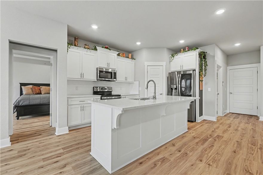 Preferred lender credit up to $3k! This single-level home delivers the lifestyle home buyers move here for without sacrificing everyday comfort. Built in 2022, this 4-bedroom, 2-bath home offers 1,975 sqft of thoughtfully designed living space with an open, functional layout ideal for both daily life and entertaining. The kitchen flows seamlessly into the main living area, while the split floor plan provides privacy where it matters most. Step outside to a fenced backyard with a gentle slope that is perfect for pets, play, or relaxing evenings outdoors with views of the wooded backdrop. Located just minutes from Bella Vista’s renowned trail system, lakes, golf courses, and parks, you’ll enjoy quick access to outdoor recreation while still being close to Bentonville shopping, dining, and everyday conveniences. Whether you’re seeking low-maintenance living, newer construction without the price tag, or a true Bella Vista lifestyle, this home checks all the right boxes.