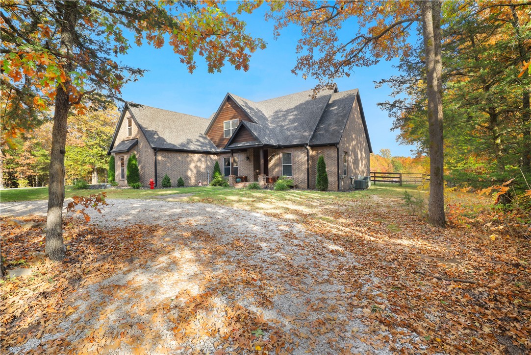 SECLUDED Beautiful 4 bed, 3 bath home includes everything you need just 15 mins from town. It features a large open kitchen and living room area with wood burning fireplace for the cold months. Two bedrooms and two full baths downstairs with two bedrooms, full bath and bonus room upstairs. Enjoy 10 acres of secluded privacy with plenty wildlife(deer, turkey, bear, etc..). The covered back porch also includes a wood burning fireplace, and is a perfect place to enjoy the peace and quiet.