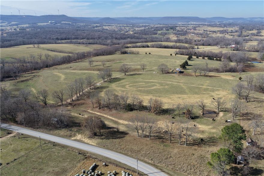 Located on Denver Rd less than 1 mile off Hwy 62, this 94± acre working farm in Carroll County offers a turnkey livestock and hay operation just 16 minutes from Harrison and 10 minutes from Green Forest. The property is predominantly open and fully fenced and cross-fenced for rotational grazing, featuring 6 ponds, 3 automatic waterers, and scattered mature hardwoods that provide excellent shade for livestock. Improvements include working pens, a chute, and a shed for equipment or storage. Currently utilized for cattle and hay production, the farm is ready for immediate use with no additional setup required. With quality county road access, a highly functional layout, and strong agricultural usability, this tract is ideal for a first-time farm buyer or anyone looking to expand an existing operation in a convenient, productive location.